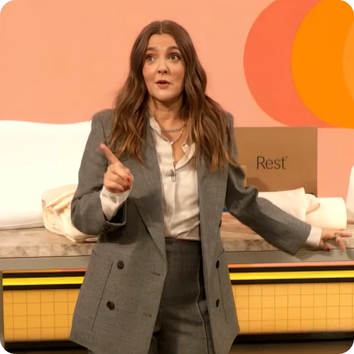 Drew Barrymore next to a Rest bed